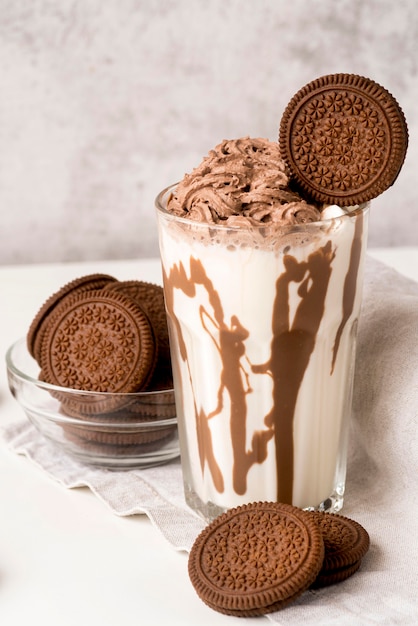 High angle of glass of dessert with chocolate and biscuits