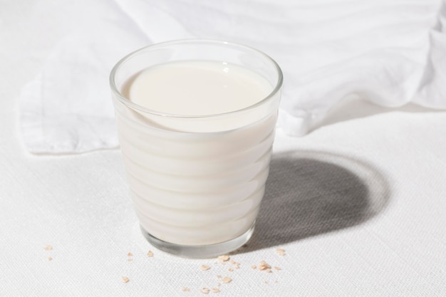 High angle of glass of milk