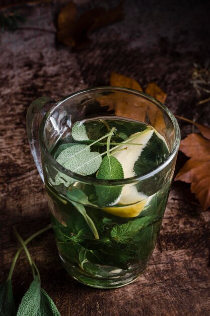 High angle glass with hot water and lemon