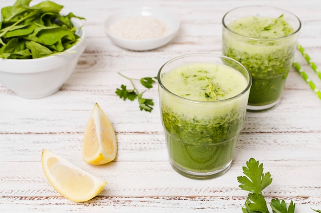 High angle of glasses of healthy smoothies