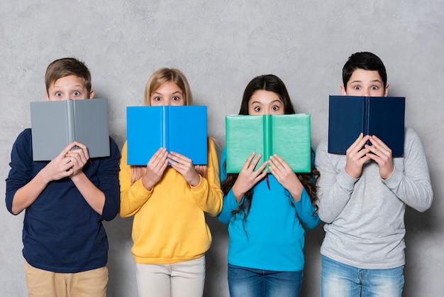 Free Photo high angle group of kids with books