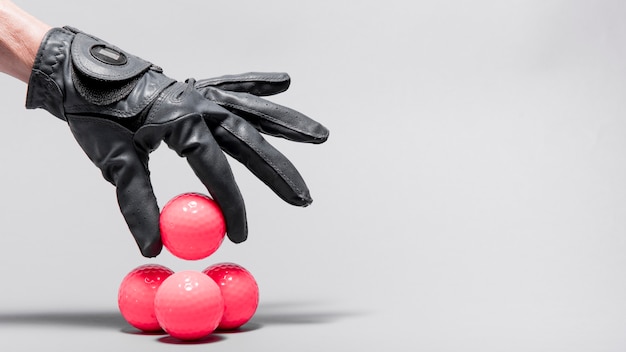 High angle hand arranging golf balls