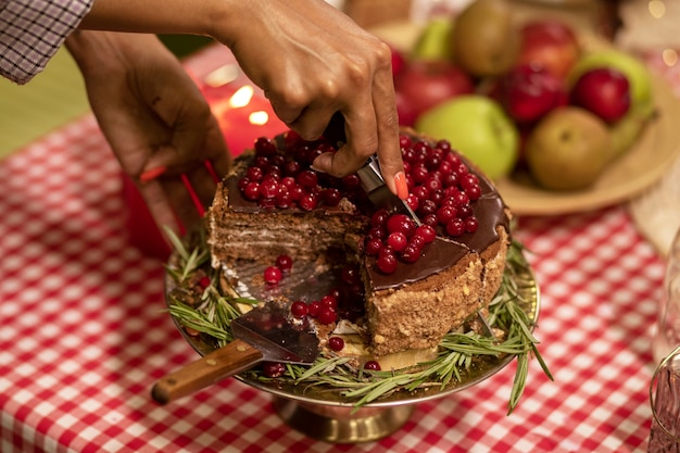 High angle hand cutting cake