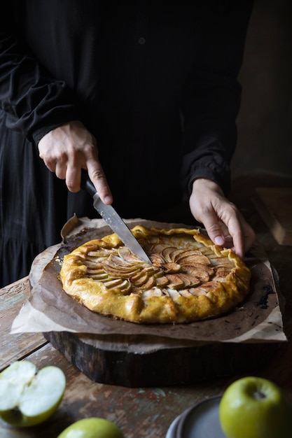 High angle hand cutting dessert slice