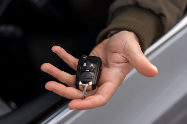 Free photo high angle hand holding car key