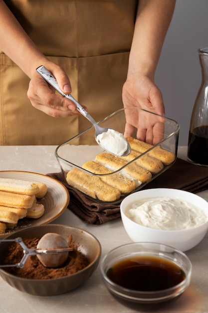 High angle hands cooking delicious tiramisu