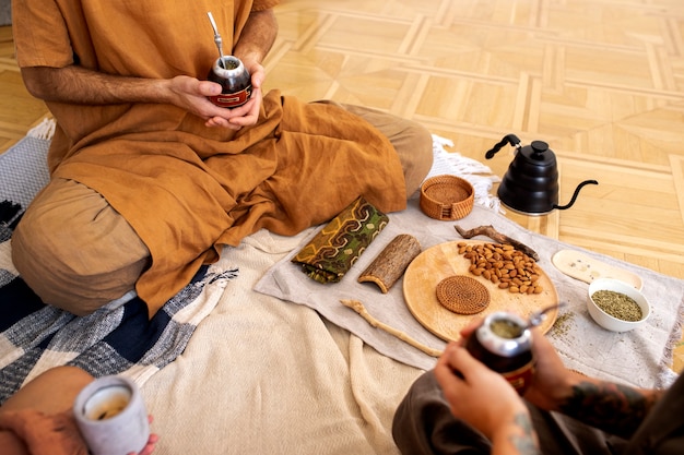 Free photo high angle hands holding cups