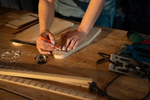 High angle hands measuring with ruler