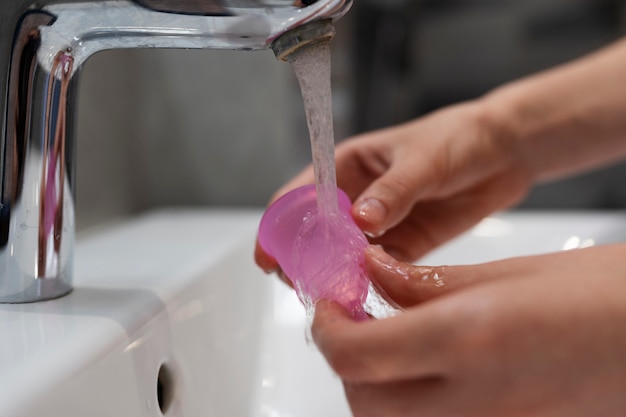 High angle hands washing menstrual cup