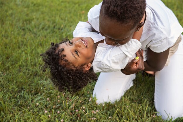 High angle happy black family in nature