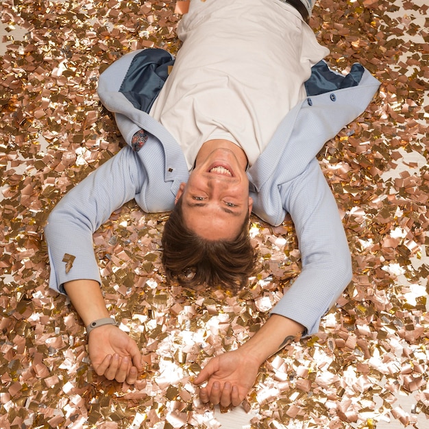 Free photo high angle of happy man celebrating new year