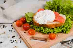 Free photo high angle healthy breakfast on wooden board