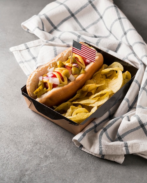 Free Photo high angle hot-dog and chips with american flag