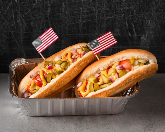 Free Photo high angle hot-dogs with american flag in tray