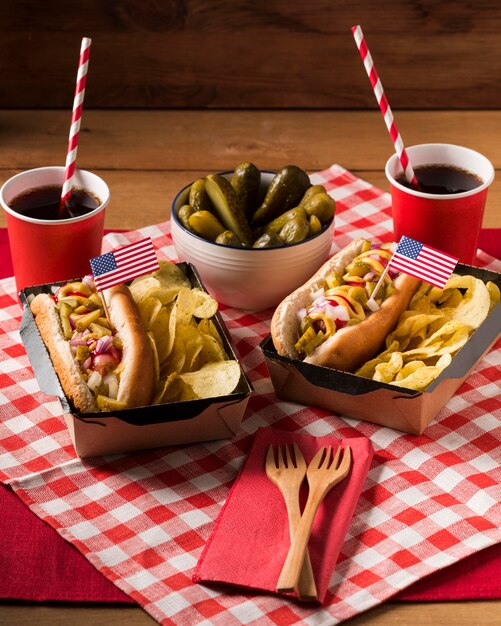 Free Photo high angle hot-dogs with chips and pickles