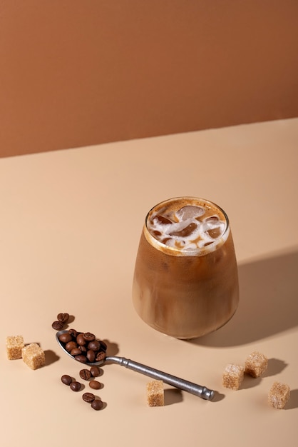 High angle iced coffee and sugar cubes