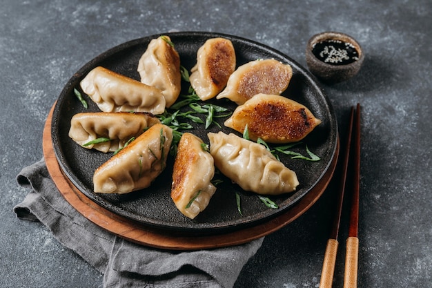 Free photo high angle japanese dumplings assortment