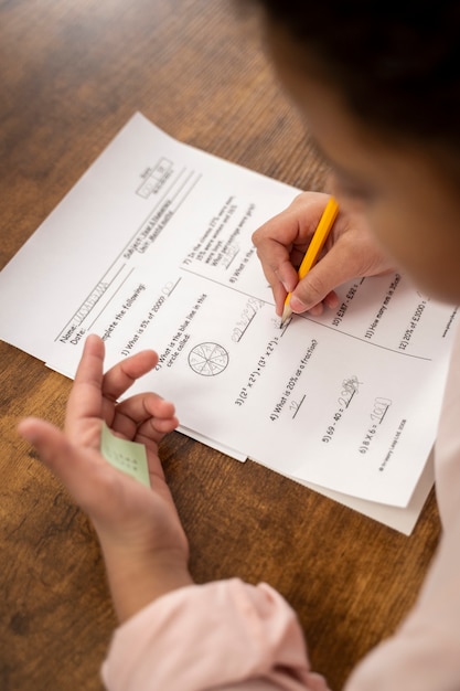 Free Photo high angle kid cheating at school test