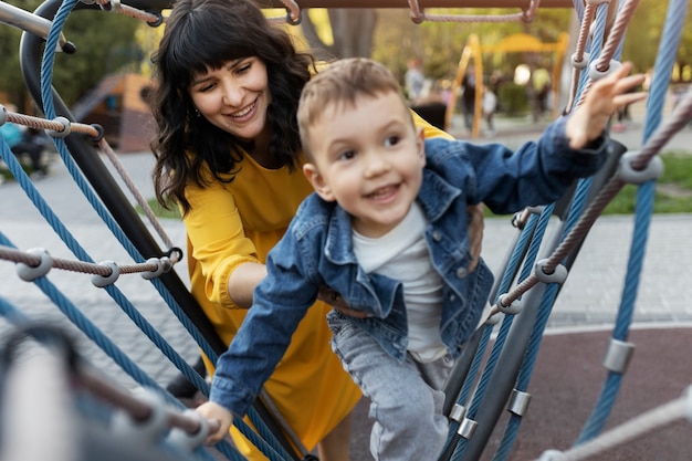 High angle kid and mother playing together