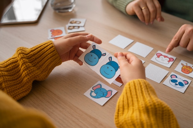 Free photo high angle kid playing memory game