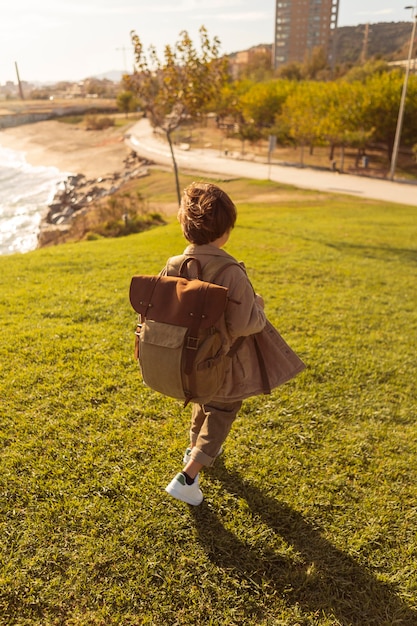 Free photo high angle kid wearing backpack