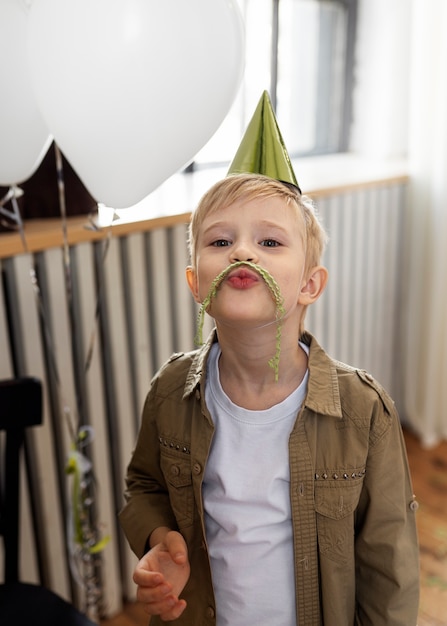 High angle kid wearing party hat