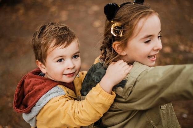 Free photo high angle kids having fun outdoors