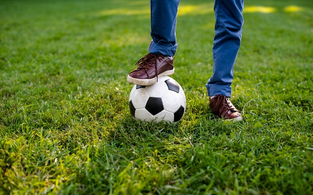 High angle leg on football ball