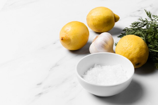 High angle lemons and garlic arrangement