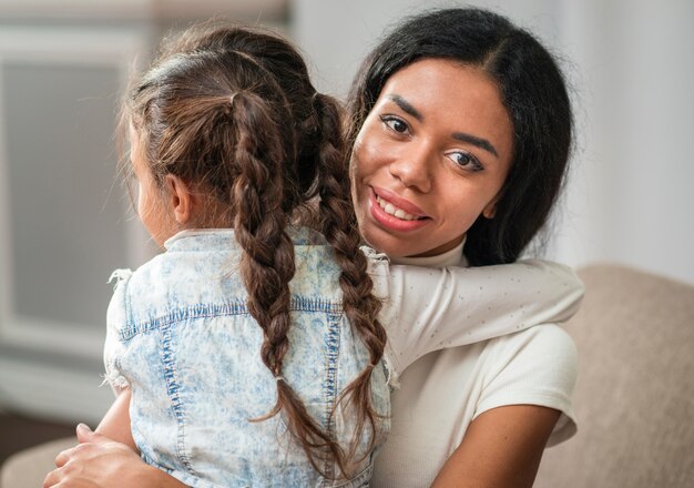 High angle little girl hugging mom