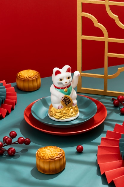 Free photo high angle lucky cat on plate