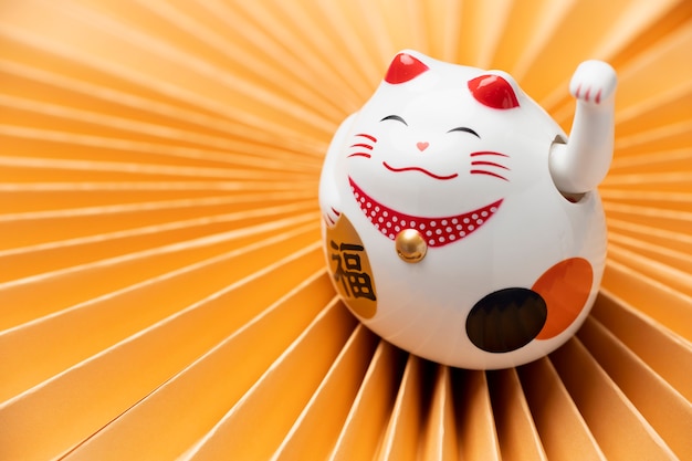 High angle lucky cat with yellow background