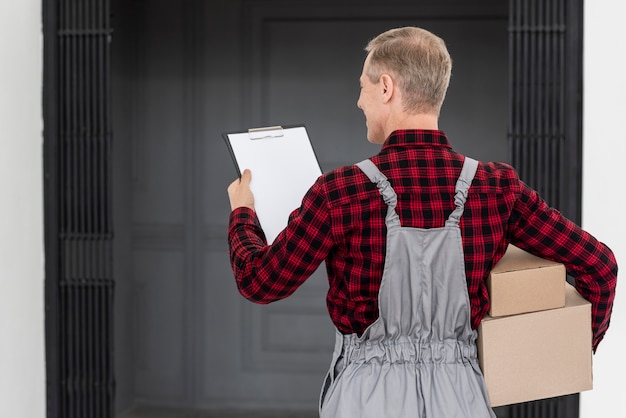 High angle man delivering package