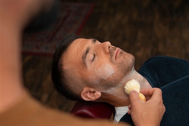 High angle man getting groomed