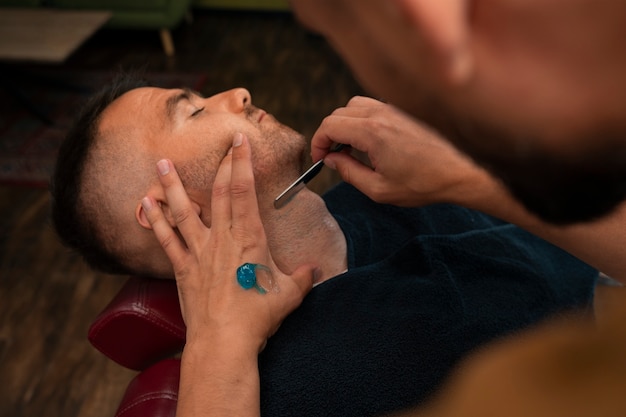 High angle man getting groomed