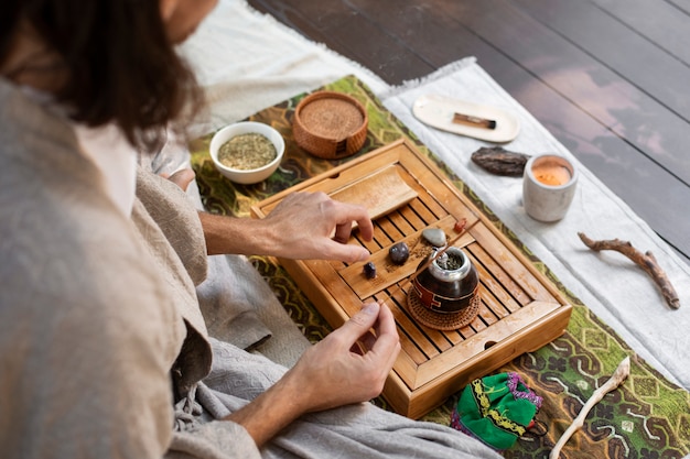 High angle man preparing yerba mate