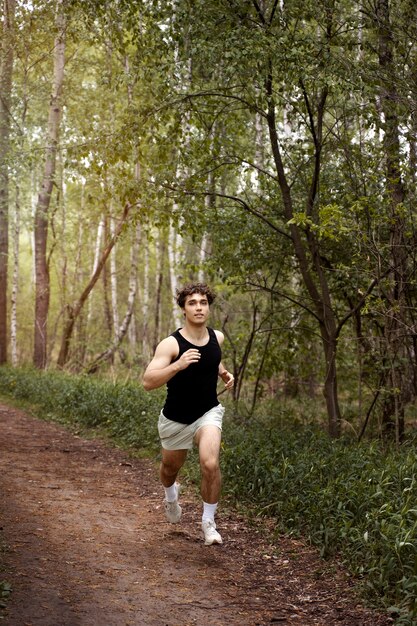 High angle man running in nature