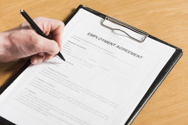 Free Photo high angle of man signing contract for new job