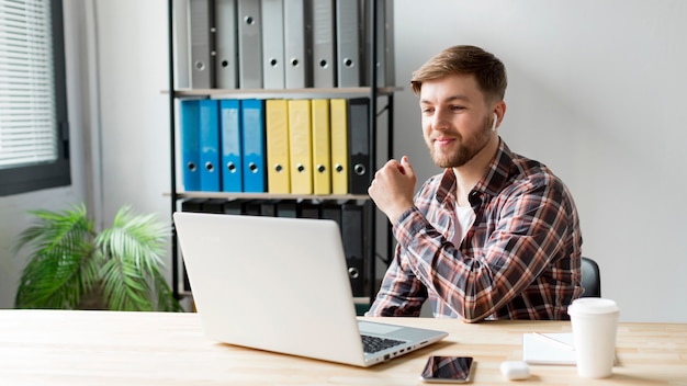 High angle man working on laptop