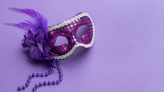 High angle of mask for carnival with beads and feathers