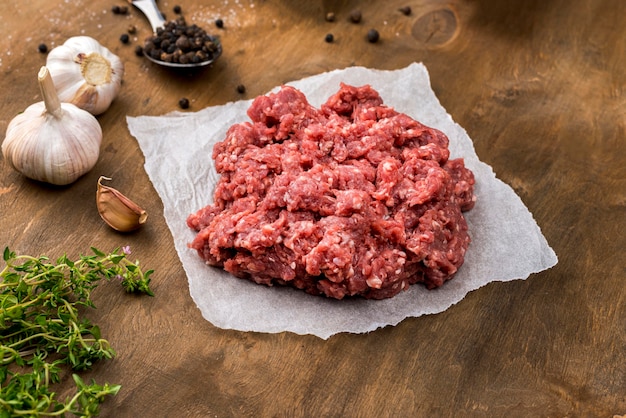 Free Photo high angle of meat with herbs and garlic