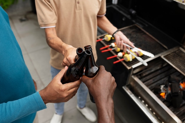 High angle men holding drinks