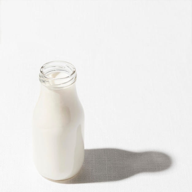 High angle of milk bottle with copy space