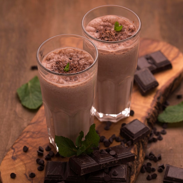 High angle of milkshake glasses with mint and chocolate