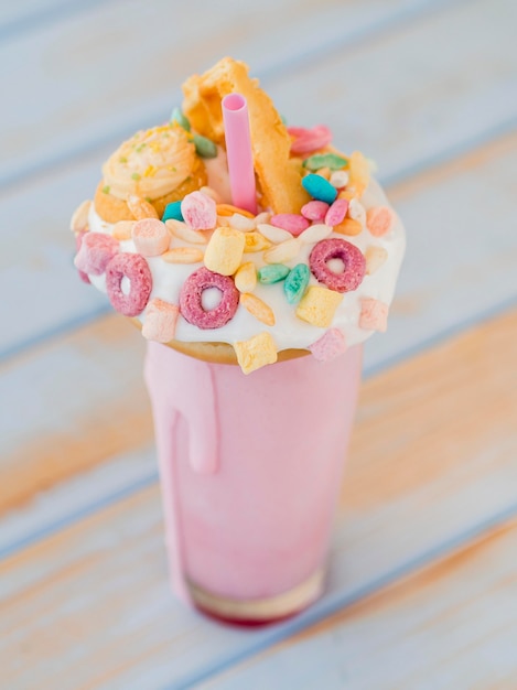 High angle milkshake on wooden background