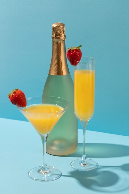 High angle mimosa cocktail with strawberries