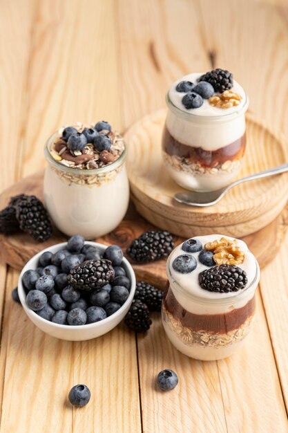 High angle mix of yogurt with blueberries and blackberries