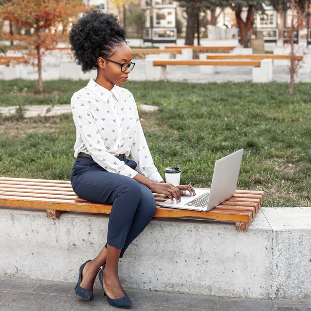 High angle moder woman working on bench