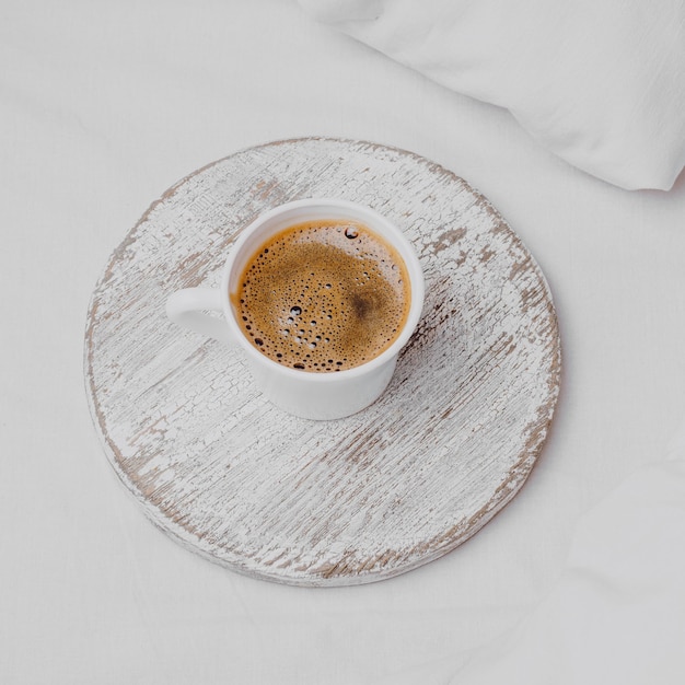 High angle of morning coffee on bed