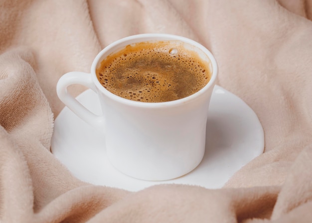 Free Photo high angle of morning coffee cup on bed